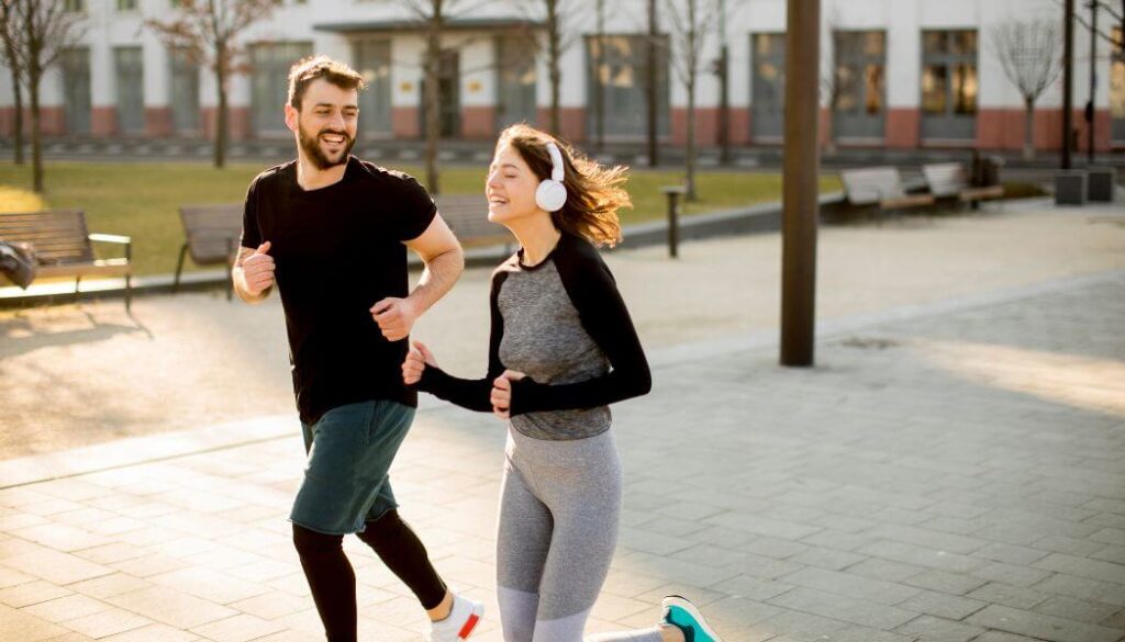man and woman running outdoors