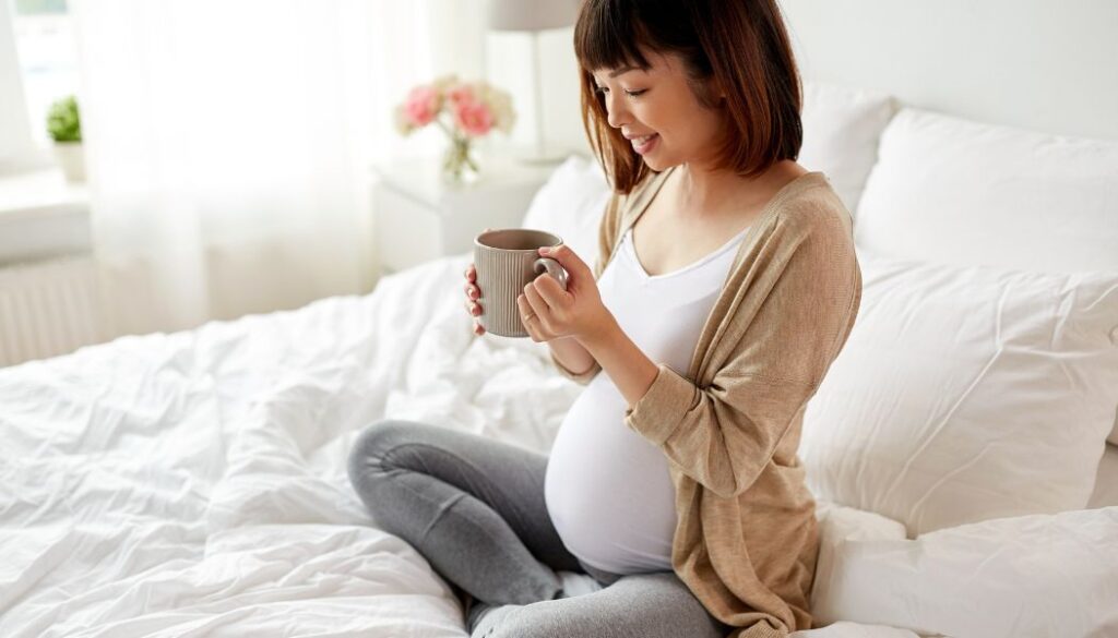 pregnant woman drinking tea
