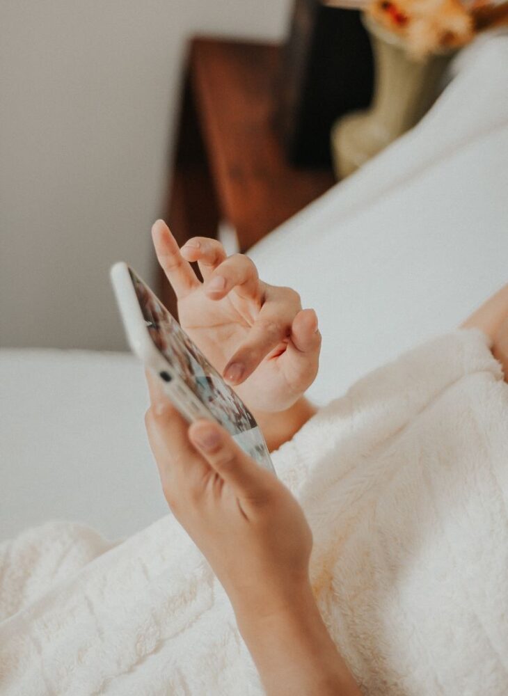 woman scrolling on her phone