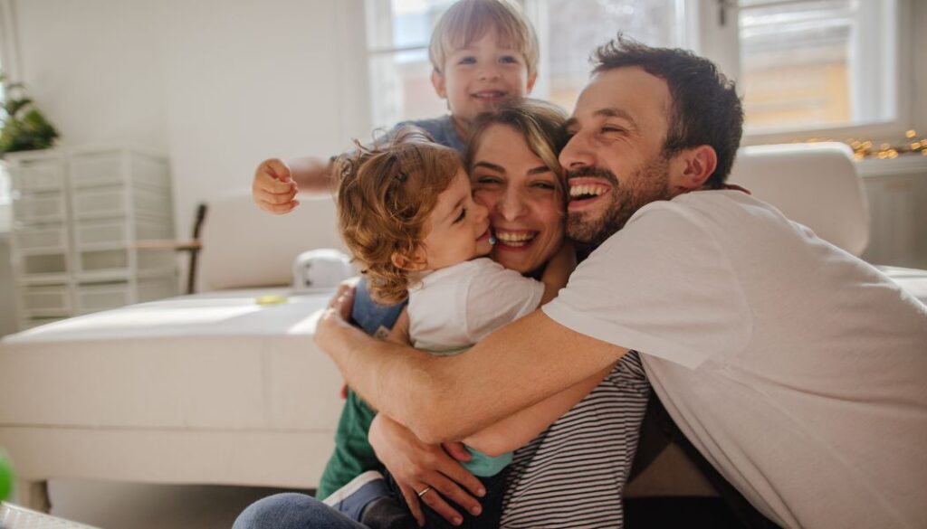parents hugging their kids