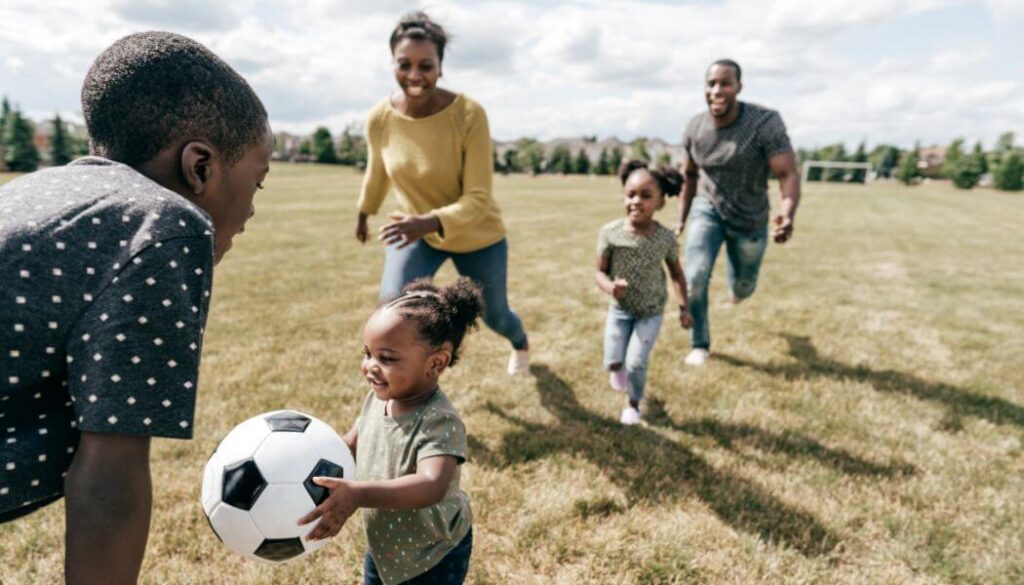 families playing together outdoors