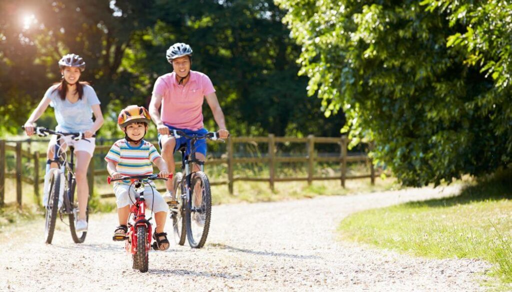 mom, dad and kid riding bikes