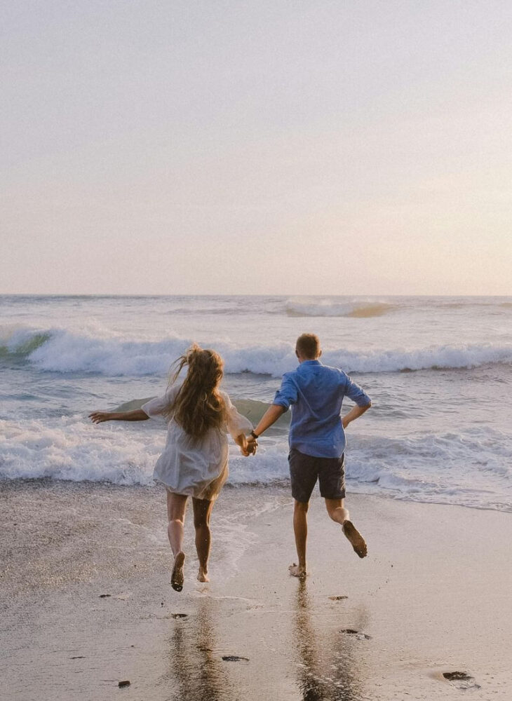 couple entering the sea together