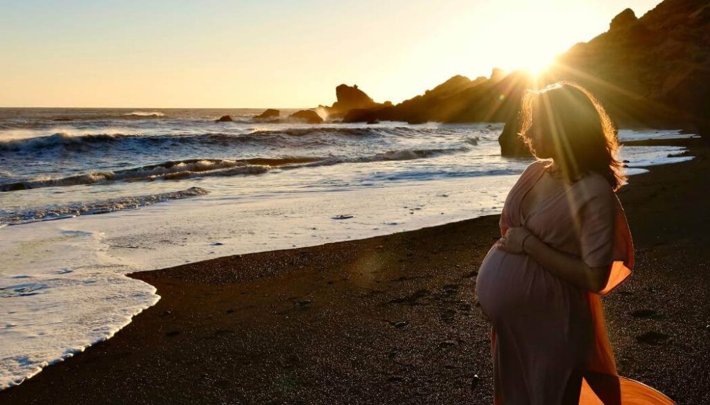 pregnant woman at sunset