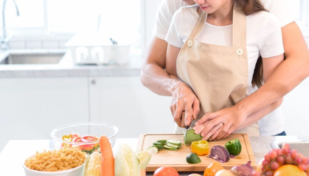 couple cooking together in a kitchen