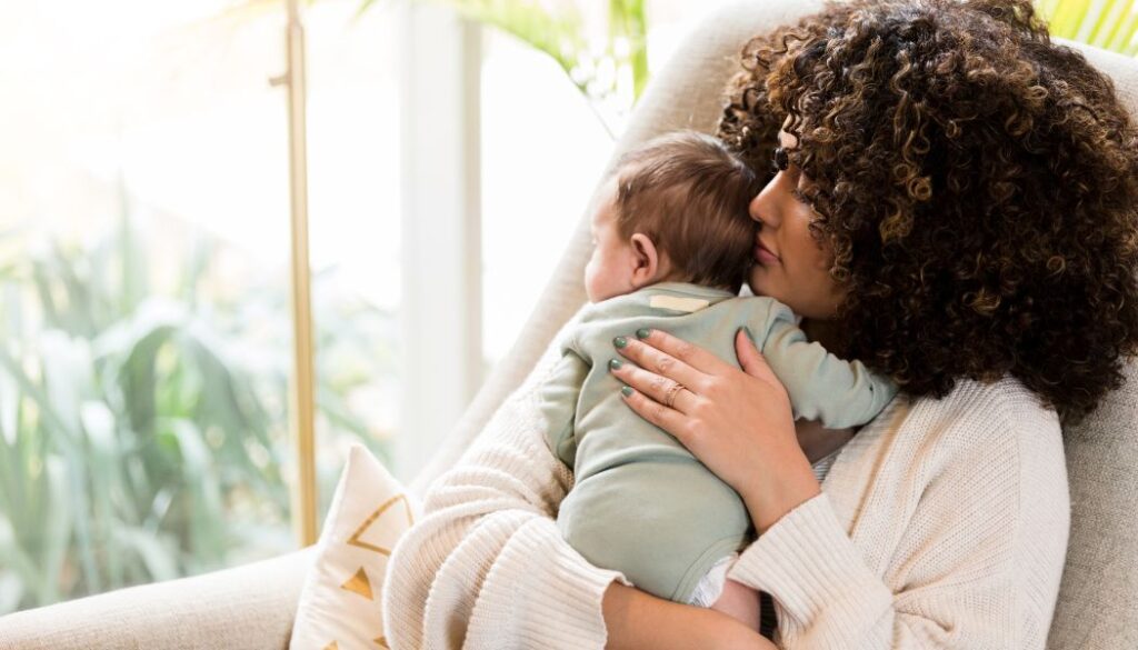 mom hugging a baby