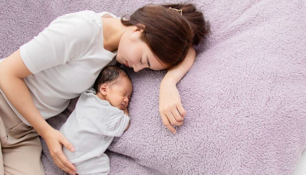 mom napping with a baby