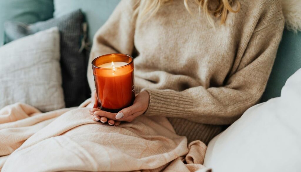 woman holding a candle