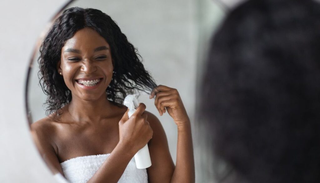 woman styling hair
