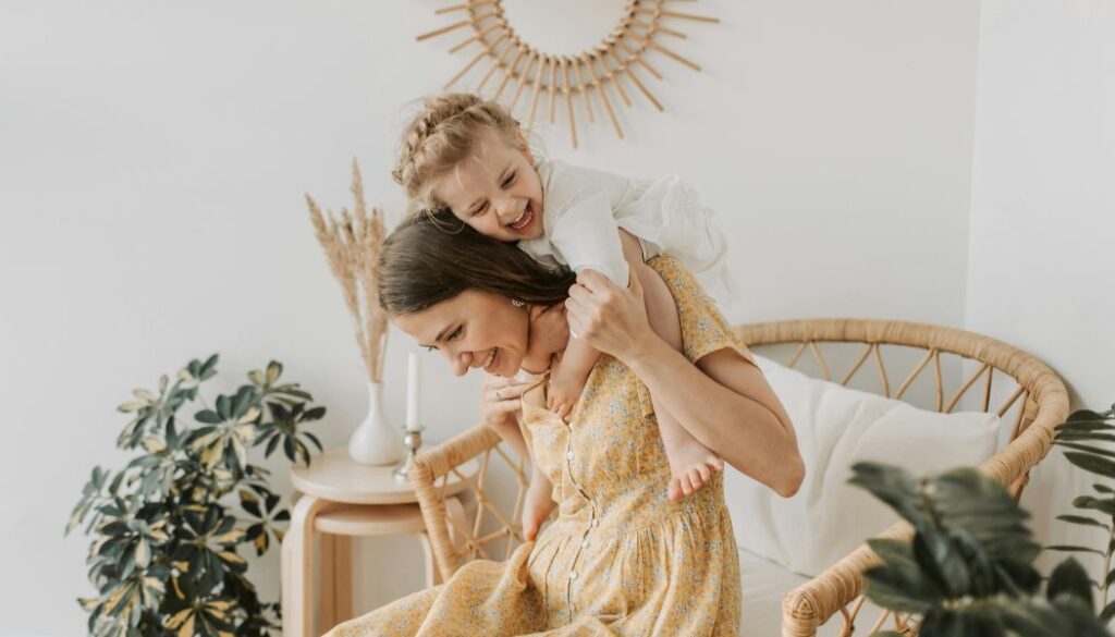 mom hugging a baby girl